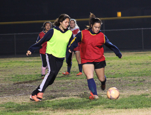 WORKING IT OUTSophomore Alexsis Duenas (left center) and Junior Casey Moore (right center) go sideby-side during Varsity Girls’ Soccer practice. Currently the team is working towards qualifying for CIF. MOOR photo by SHANNON KHA